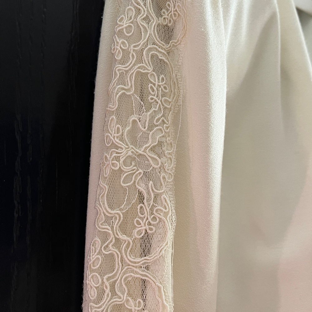 Gorgeous ivory  jacket and slacks with decorated buttons and sleeves.
